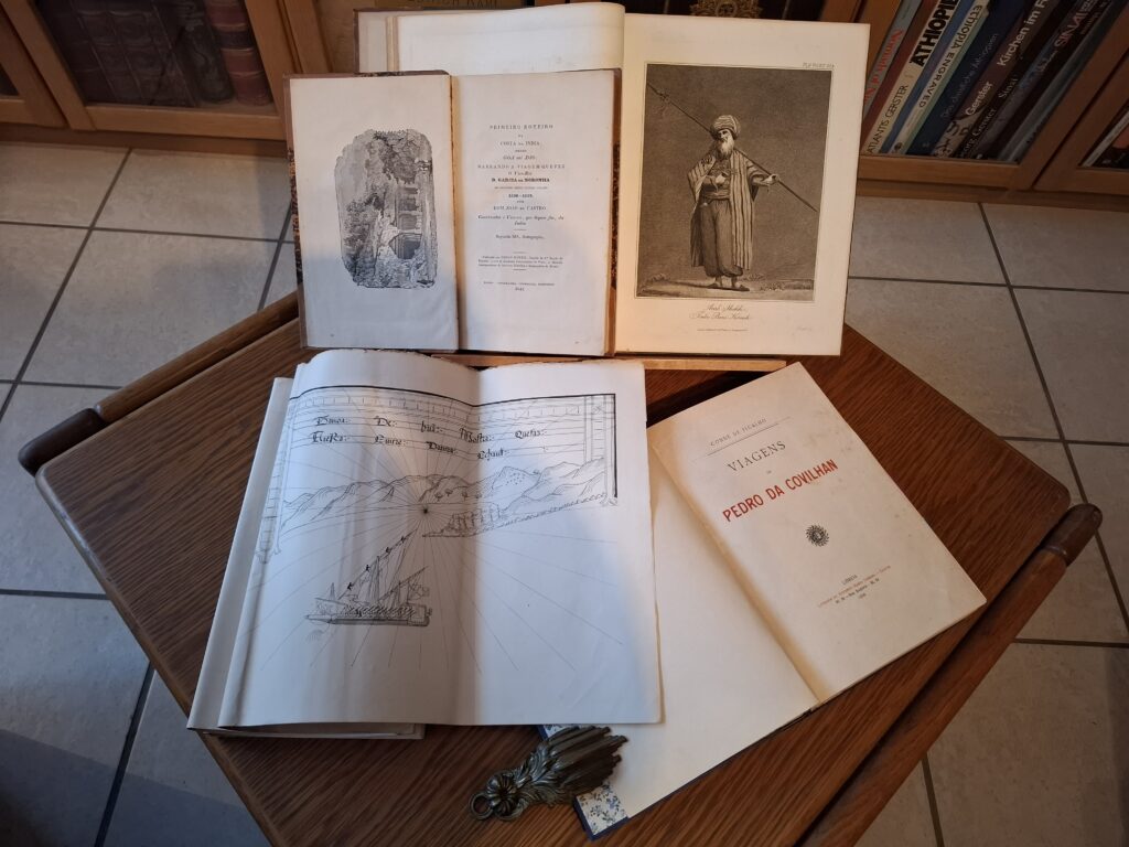Open books on a coffee table in Mike's library. Open books on a coffee table in Mike's library.